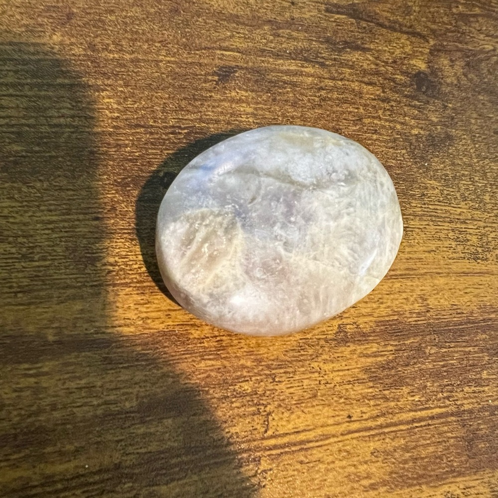 I believe this is a Sunstone Palm Stone.